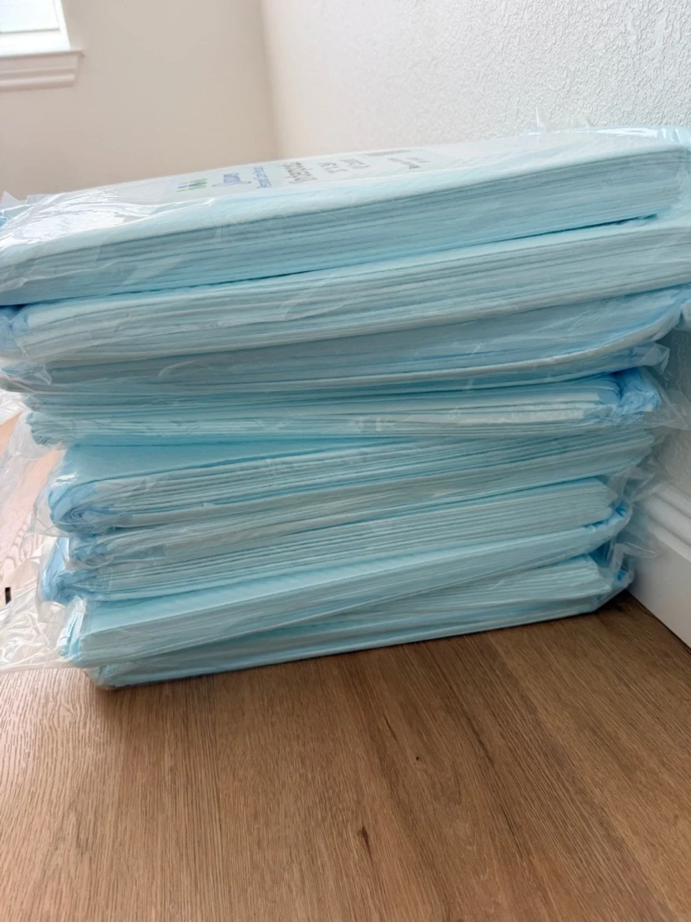 Care Products Underpads - White with Green & Blue Logo